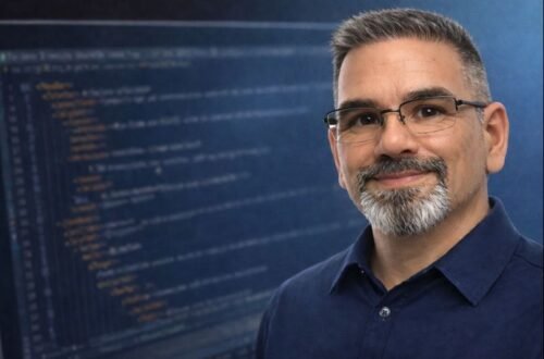 Web developer portrait with blurred HTML code in the background, representing front-end and web development fundamentals.