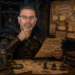 Frank Jamison portrayed as a Dungeons & Dragons inspired bug hunter and investigator, seated in a dimly lit medieval study or dungeon chamber. Wearing dark adventurer attire with leather armor and a hooded cloak, he studies a mysterious bug report with a focused, thoughtful expression while surrounded by maps, candles, dice, books, and investigative notes connected by red string on a wall labeled with debugging clues. The scene evokes a fantasy detective unraveling the root cause of a dangerous, unnatural threat.