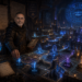 Cinematic D&D-inspired digital artwork featuring Frank Jamison as a seasoned bug hunter turned master architect-engineer standing inside a vast underground guild fortress. Wearing practical dark adventuring gear, Frank stands over a massive glowing stone planning platform, placing luminous architectural runes into an intricate magical fortress under construction. Around him are glowing ward systems representing validation and testing, magical roadways symbolizing software boundaries, floating diagrams, observability crystals projecting system maps, and shadowy corrupted creatures trapped behind reinforced magical barriers. Ancient stone walls, enchanted blueprints, debugging notes, and layered defenses create a thoughtful mentor-like atmosphere illuminated by deep blue, violet, ember, and gold light, with dark negative space framing the right side of the scene.